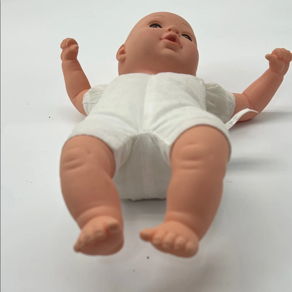 Realistic Baby Doll with White Outfit